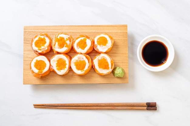 fresh salmon sushi roll with mayonnaise and shrimp egg