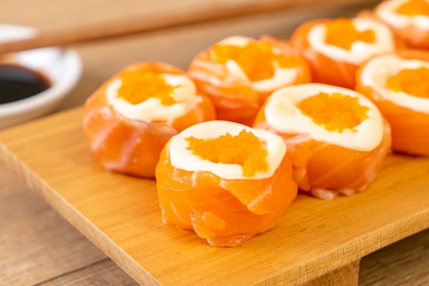 fresh salmon sushi roll with mayonnaise and shrimp egg