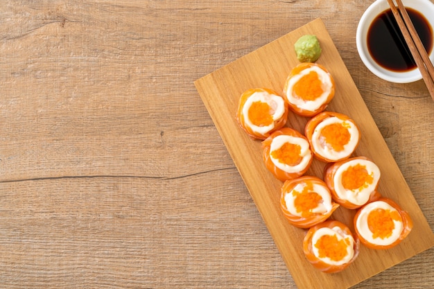 fresh salmon sushi roll with mayonnaise and shrimp egg