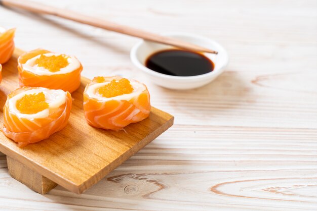 fresh salmon sushi roll with mayonnaise and shrimp egg