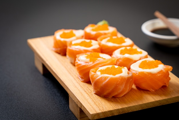 fresh salmon sushi roll with mayonnaise and shrimp egg