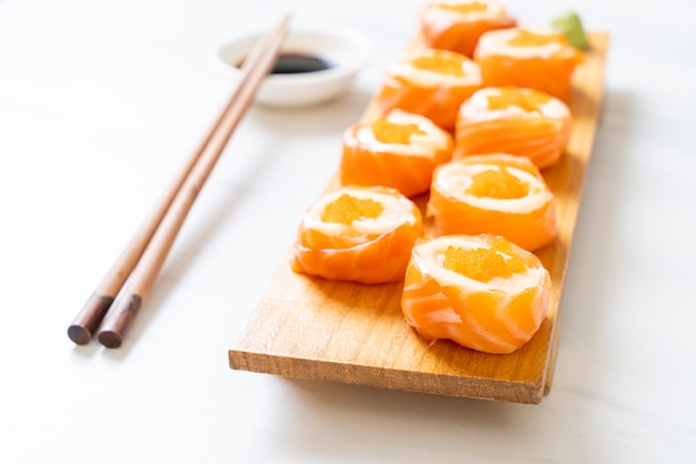 fresh salmon sushi roll with mayonnaise and shrimp egg