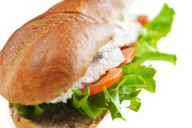 fresh sandwich close up with vegetables and meat fish isolated on white background