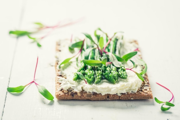 Fresh sandwich with creamy cheese and asparagus