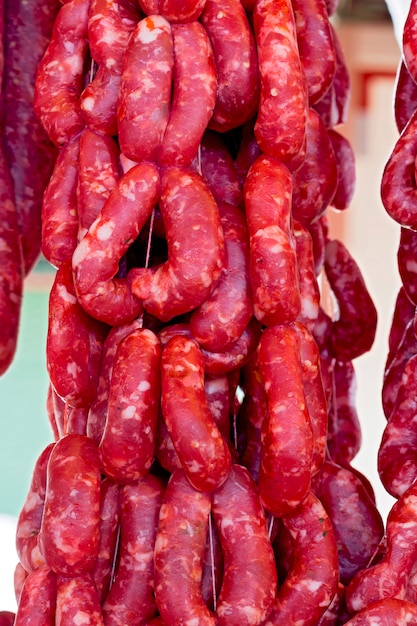 Fresh sausage exposed on market stall