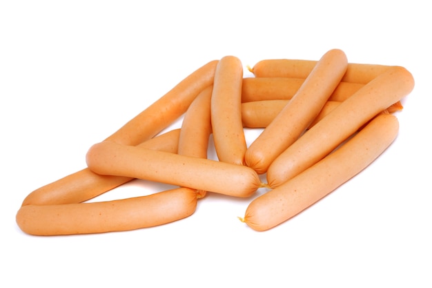 Photo a fresh sausage on white . isolated over white.