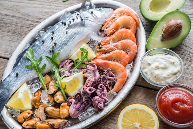 Fresh seabass with seafood on the tray