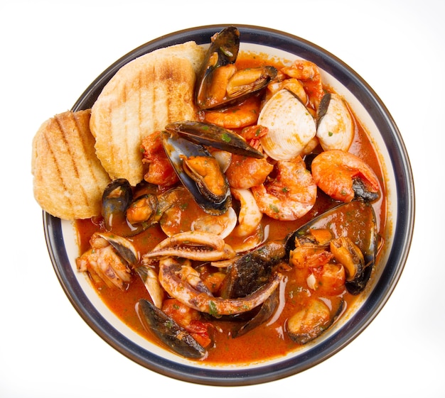 Fresh seafood soup with roasted bread