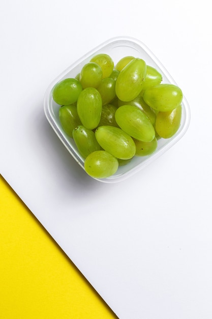 Fresh seasonal grapes in Plastic container