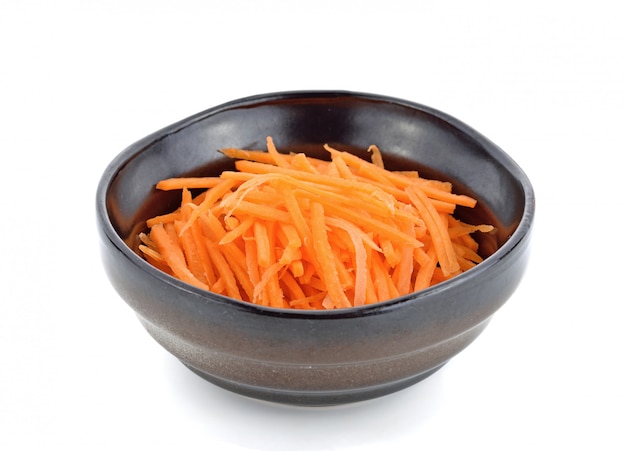 fresh shredded carrots in bowl 