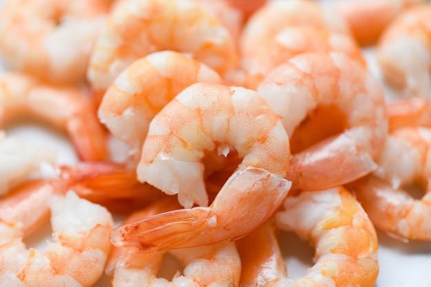 Fresh shrimps served on plate, boiled peeled shrimp prawns cooked in the seafood restaurant