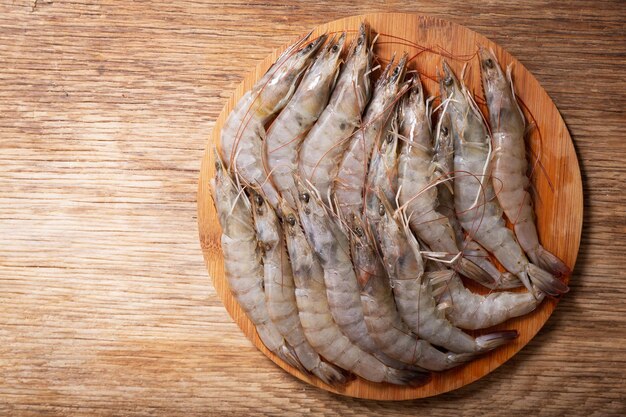 Fresh shrimps on a wooden board