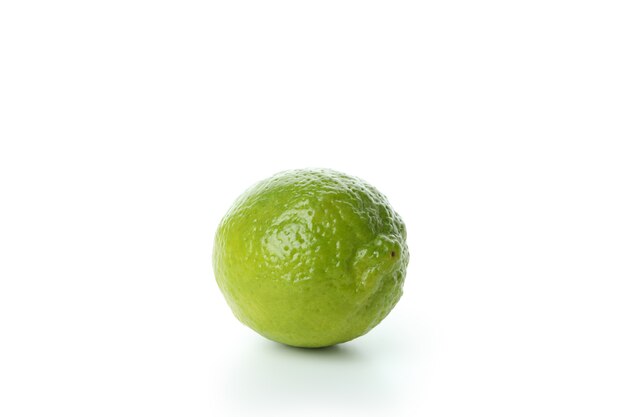 Fresh single lime isolated on white