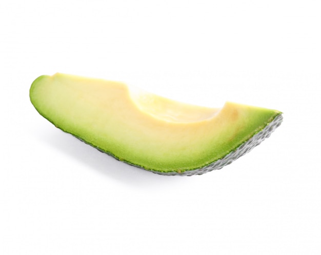 Fresh slice of avocado isolated on white