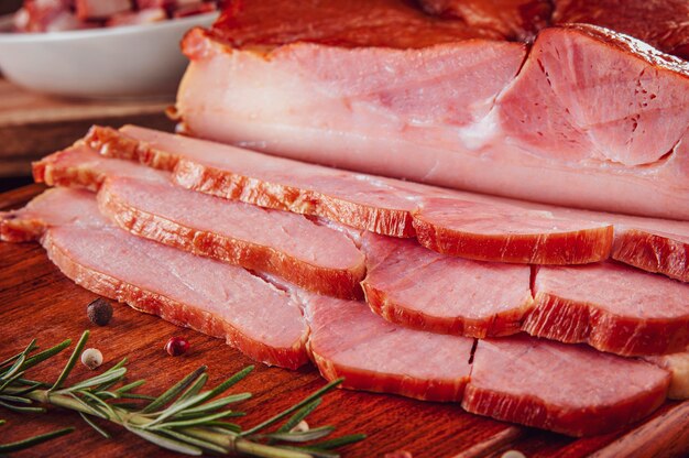 Fresh sliced bacon with rosemary branch and spices