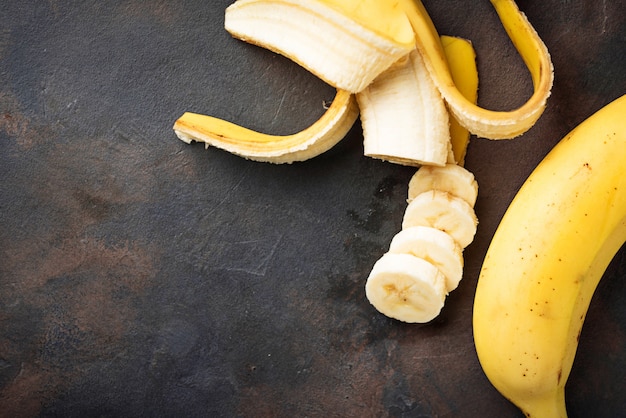 Fresh sliced banana on dark background