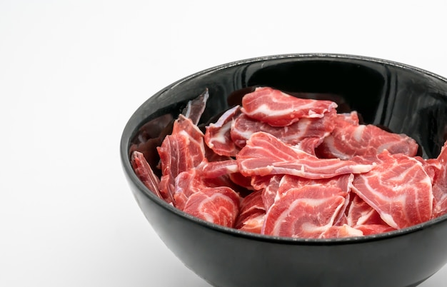 Fresh sliced beef hind shank in black ceramic bowl