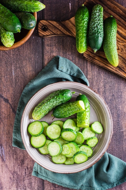 Fresh sliced cucumbers on a plate on the table Dietary organic food Top and vertical view