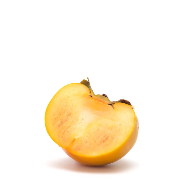 Fresh sliced persimmon on white isolated surface