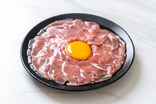 fresh sliced pork raw with egg