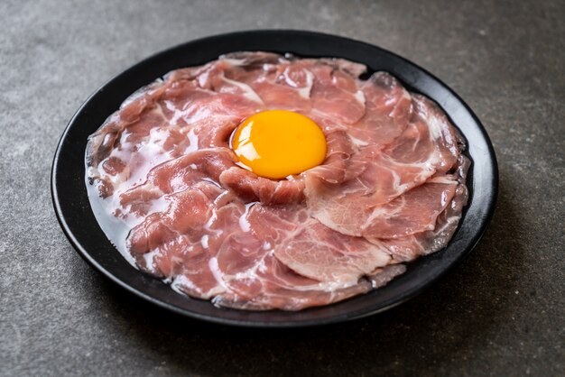 fresh sliced pork raw with egg