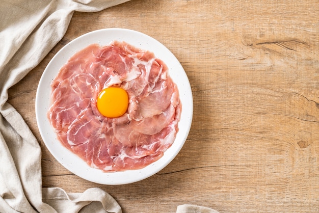 fresh sliced pork raw with egg