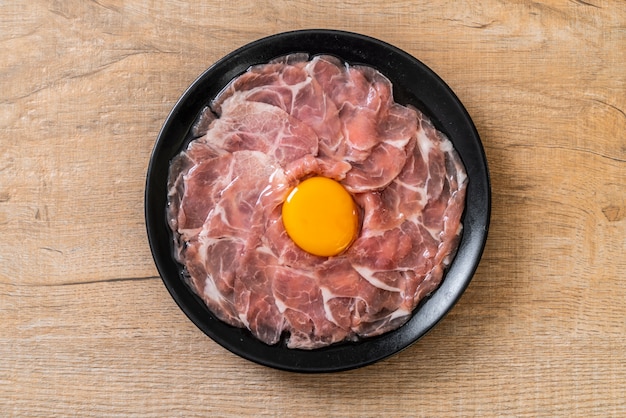 fresh sliced pork raw with egg