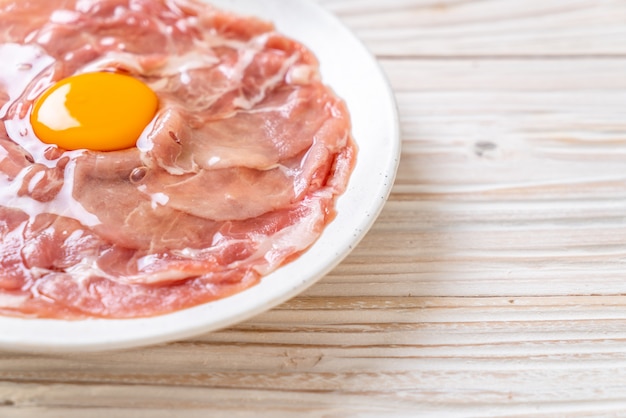 fresh sliced pork raw with egg