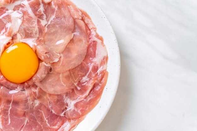 fresh sliced pork raw with egg