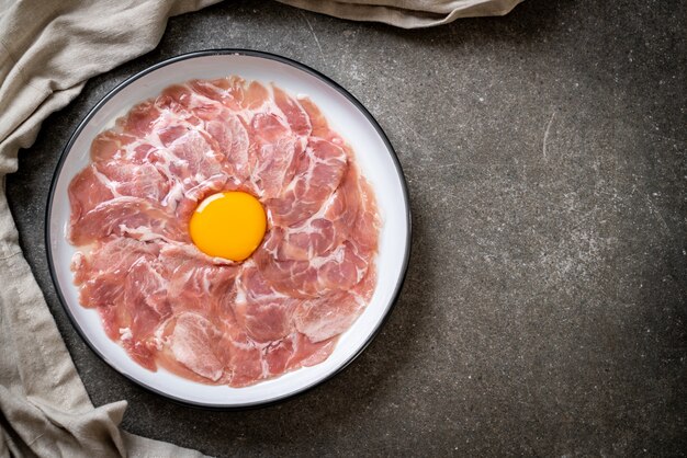 fresh sliced pork raw with egg