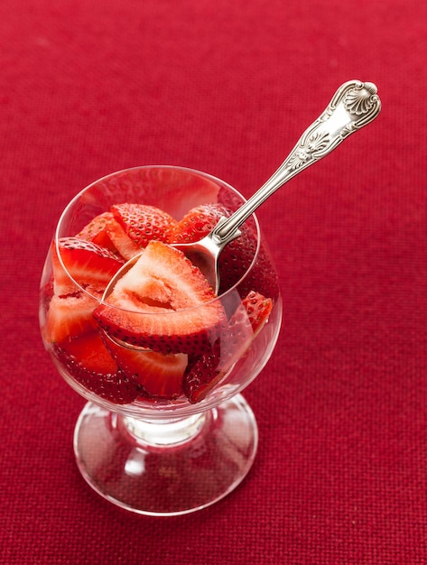 Fresh sliced strawberries in glass dish