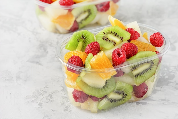 Fresh Sliced Tropical Fruits Berries in Container