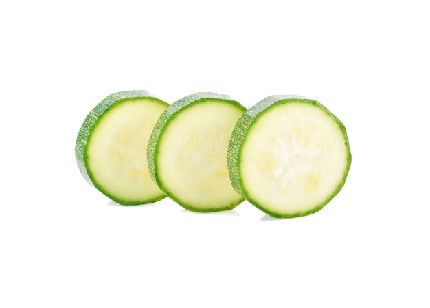 Fresh slices of zucchini isolated on white background