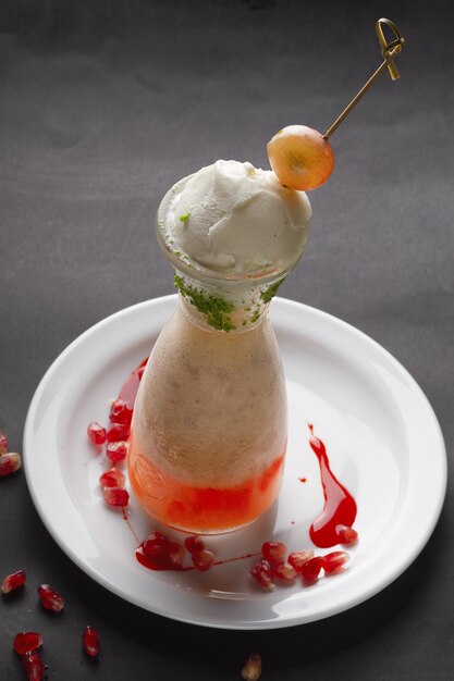 fresh smoothie with icecream ball on top  