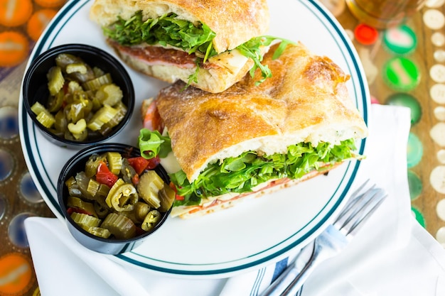 Fresh specialty sub sandwich with melted mozzarella cheese in Italian restaurant.