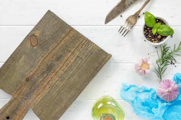 Fresh spices and a wooden board