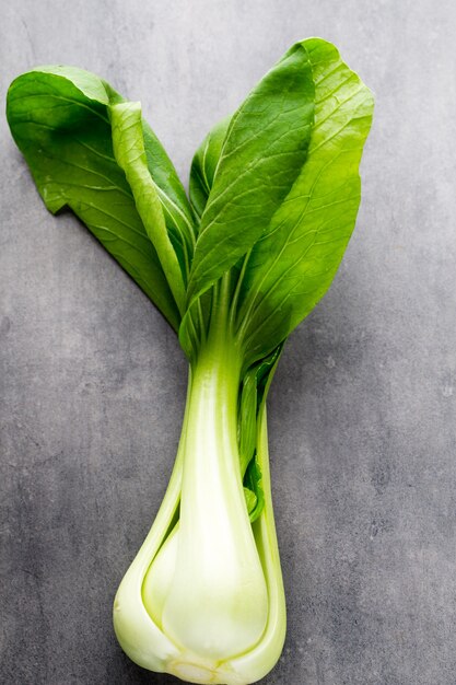 Fresh spinach on the gray mettal background.