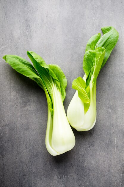 Fresh spinach on the grey table.