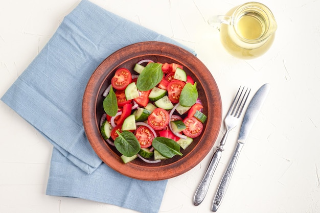 Fresh spinach leaves on a rustic wooden table. Top view.