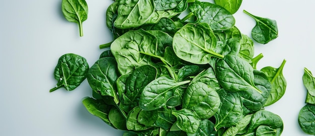 Fresh spinach leaves sprawl across a pristine surface their vibrant green hues embodying the essence of healthy eating