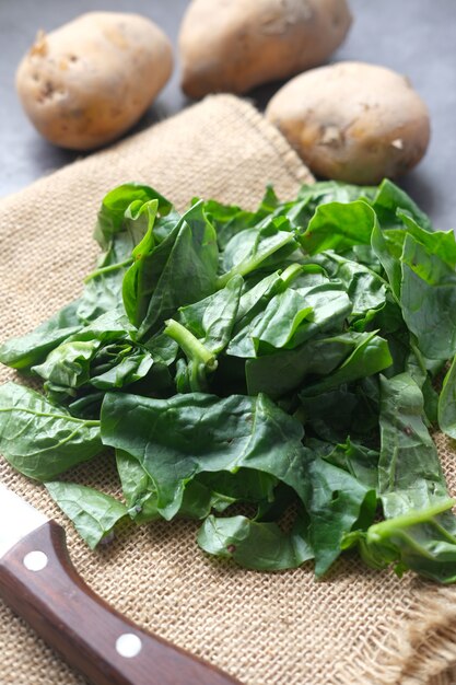 Fresh spinach leaves on table