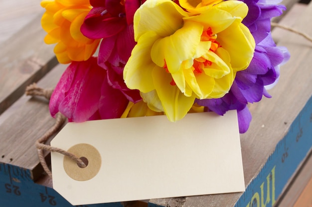 Fresh spring flowers posy  with  empty  tag