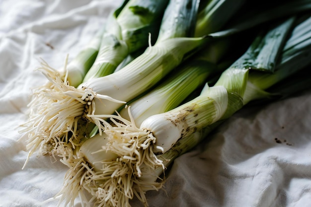 Fresh spring onions on a white tablecloth Selective focus