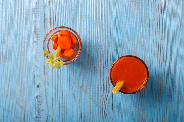 Fresh squeezed Carrot and celery juice.Vitamin summer drink.