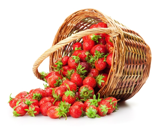 Fresh strawberries in a basket on a white background