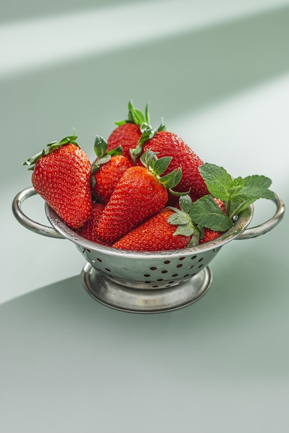 Fresh strawberries in a bowl on the table