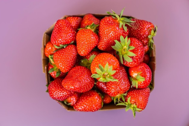 Fresh strawberries in box summer berry top view healthy food and vitamin concept