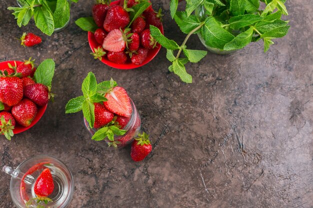 Fresh strawberries on glass jar top view