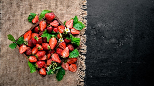 Fresh strawberries Healthy food On Wooden background Top view Free space