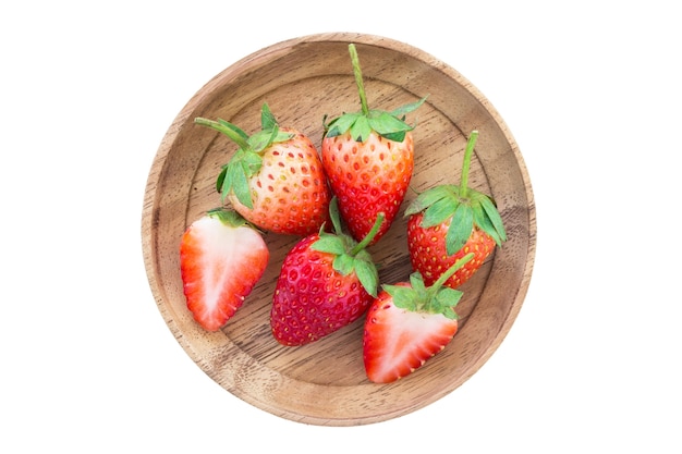 Fresh strawberries isolated in wooden plate on white background